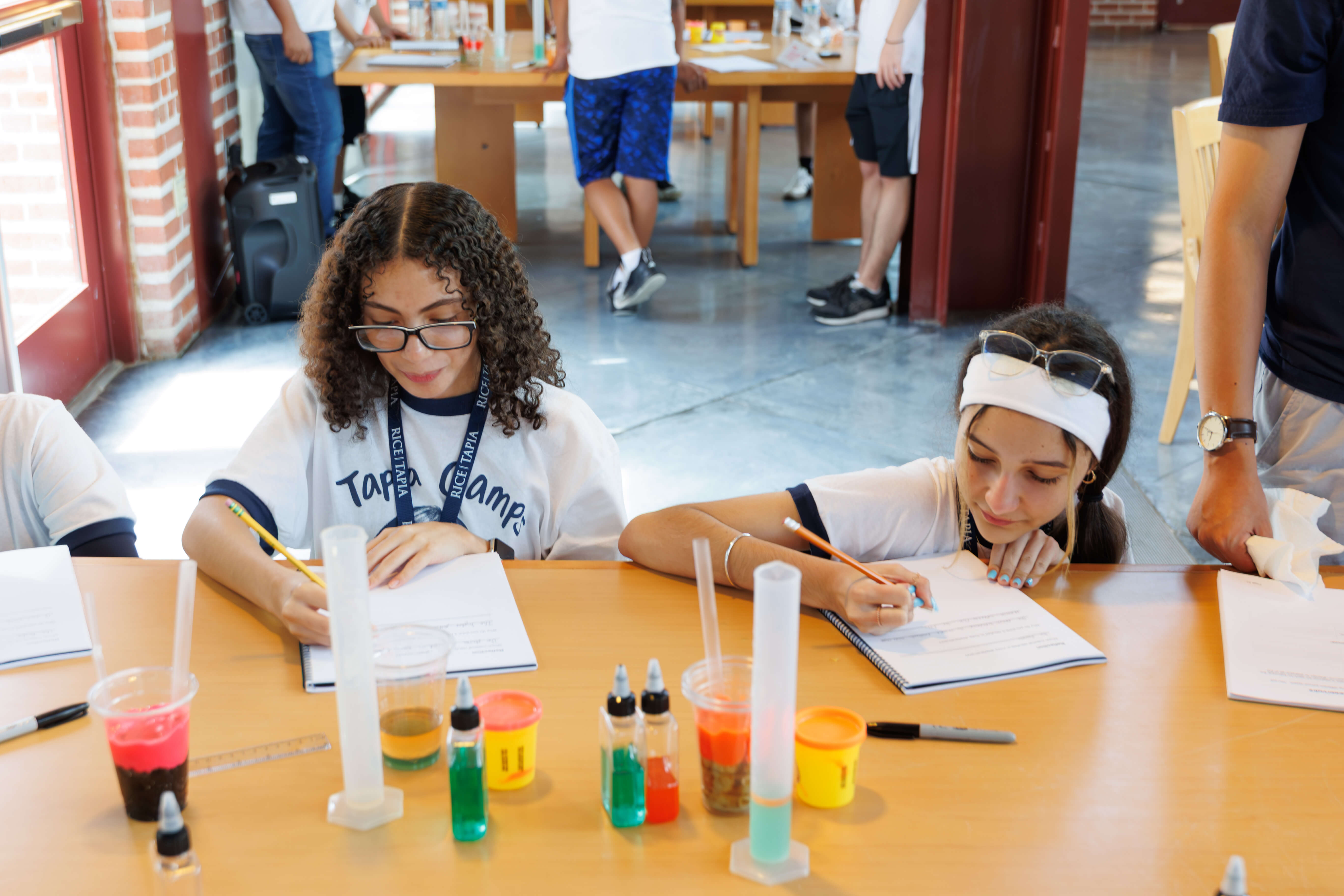 Students doing science experiments at STEM camp