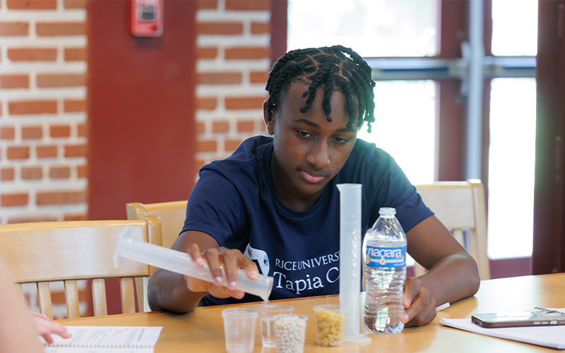 Students building reservoirs