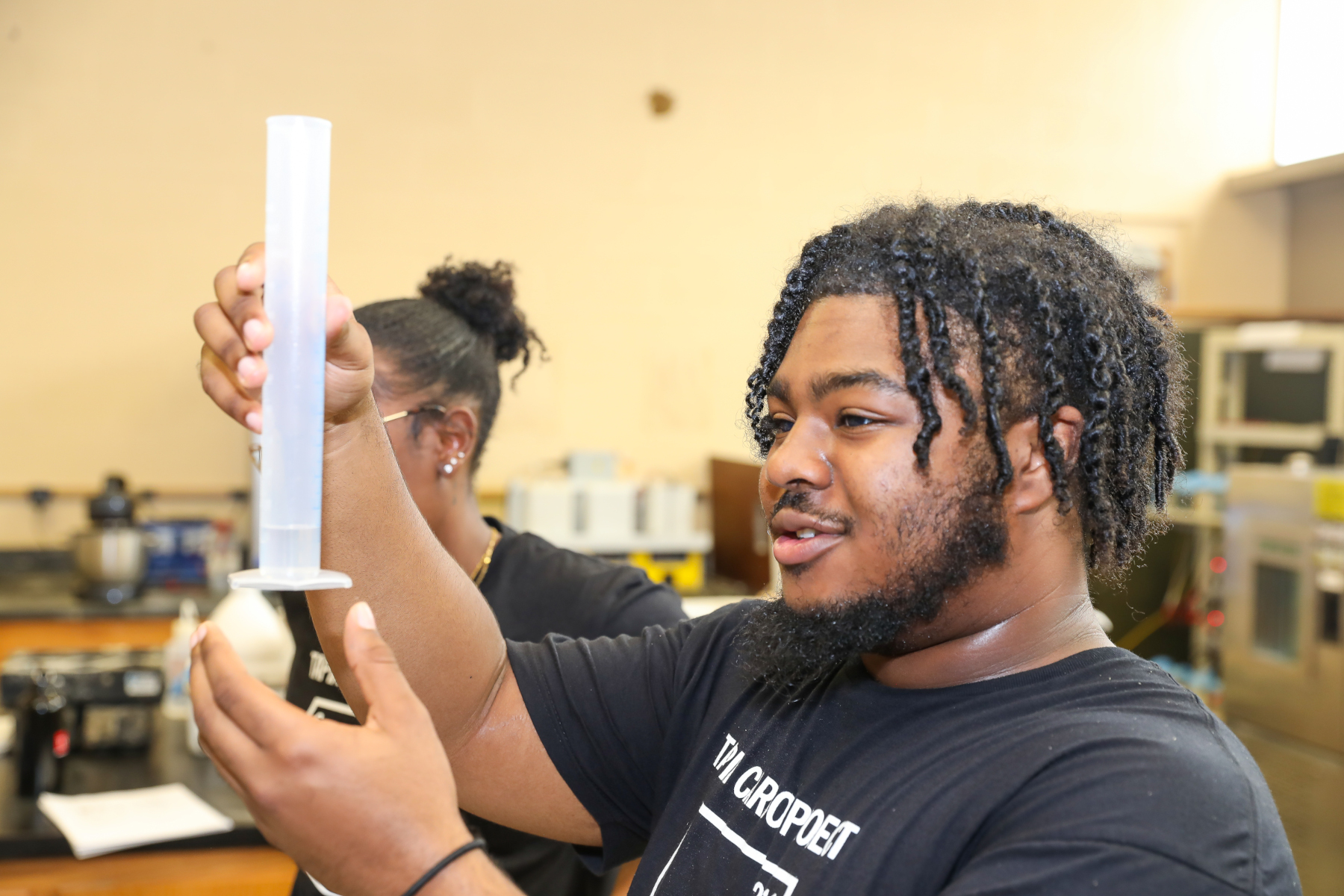 Students doing science experiments at STEM camp
